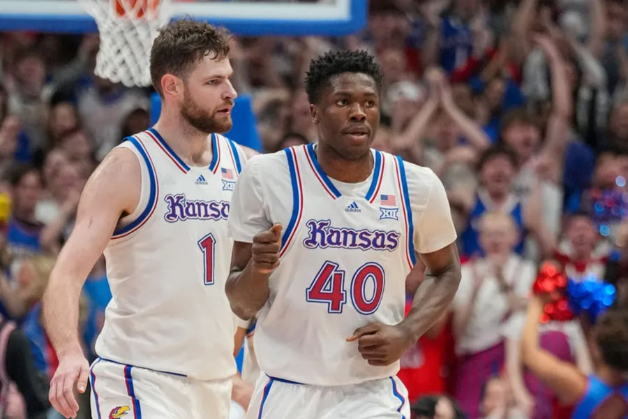 Jan 25, 2025; Lawrence, Kansas, USA; Kansas Jayhawks forward Flory Bidunga (40) celebrates with center Hunter Dickinson (1) after scoring against the Houston Cougars during the first half at Allen Fieldhouse. Mandatory Credit: Denny Medley-Imagn Images