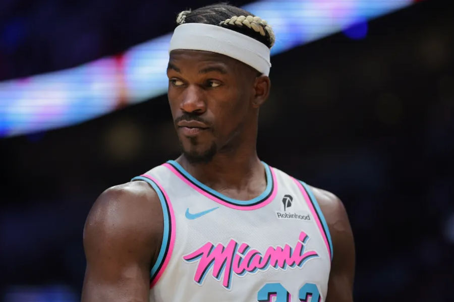 Jan 17, 2025; Miami, Florida, USA; Miami Heat forward Jimmy Butler (22) looks on against the Denver Nuggets during the third quarter at Kaseya Center. Mandatory Credit: Sam Navarro-Imagn Images