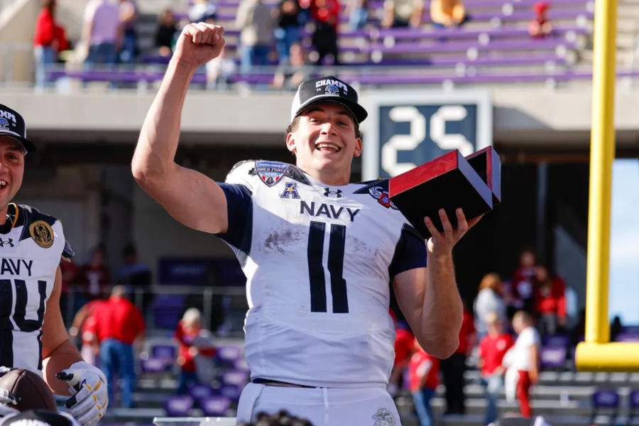 Dec 27, 2024; Fort Worth, TX, USA; Navy Midshipmen quarterback Blake Horvath (11) celebrates winning the MVP after the game against the Oklahoma Sooners at Amon G. Carter Stadium. Mandatory Credit: Andrew Dieb-Imagn Images