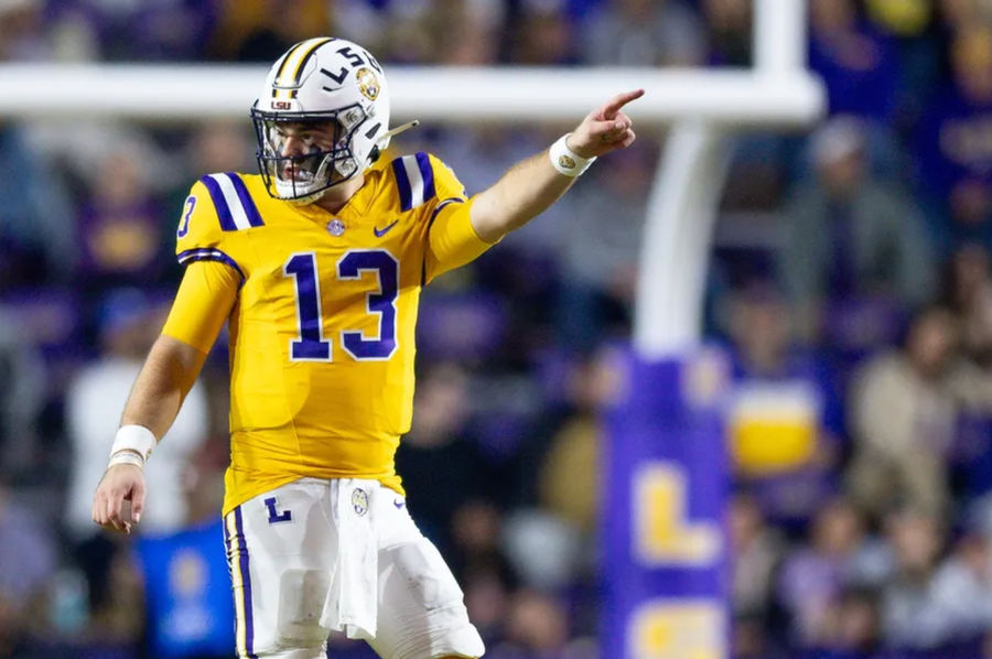 Nov 23, 2024; Baton Rouge, Louisiana, USA; LSU Tigers quarterback Garrett Nussmeier (13) signals a first down against the Vanderbilt Commodores during the second half at Tiger Stadium. Mandatory Credit: Stephen Lew-Imagn Images