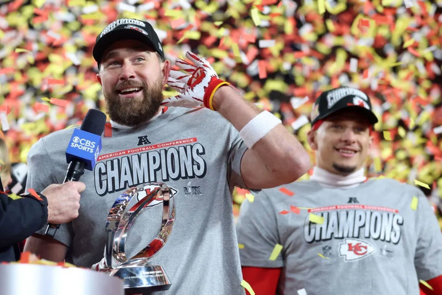 Jan 26, 2025; Kansas City, MO, USA; Kansas City Chiefs tight end Travis Kelce (87) reacts on stage after the AFC Championship game against the Buffalo Bills at GEHA Field at Arrowhead Stadium. Mandatory Credit: Mark J. Rebilas-Imagn Images