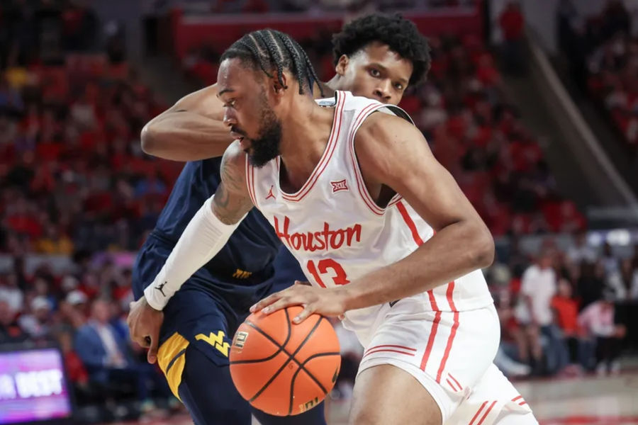 Jan 15, 2025; Houston, Texas, USA; Houston Cougars forward J'Wan Roberts (13) dribbles against West Virginia Mountaineers forward Amani Hansberry (13) in the first half at Fertitta Center. Mandatory Credit: Thomas Shea-Imagn Images