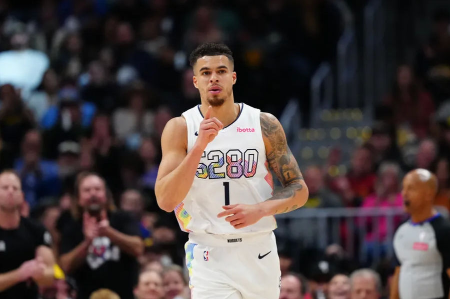 Feb 5, 2025; Denver, Colorado, USA; Denver Nuggets forward Michael Porter Jr. (1) reacts after a basket in the second quarter against the New Orleans Pelicans at Ball Arena. Mandatory Credit: Ron Chenoy-Imagn Images