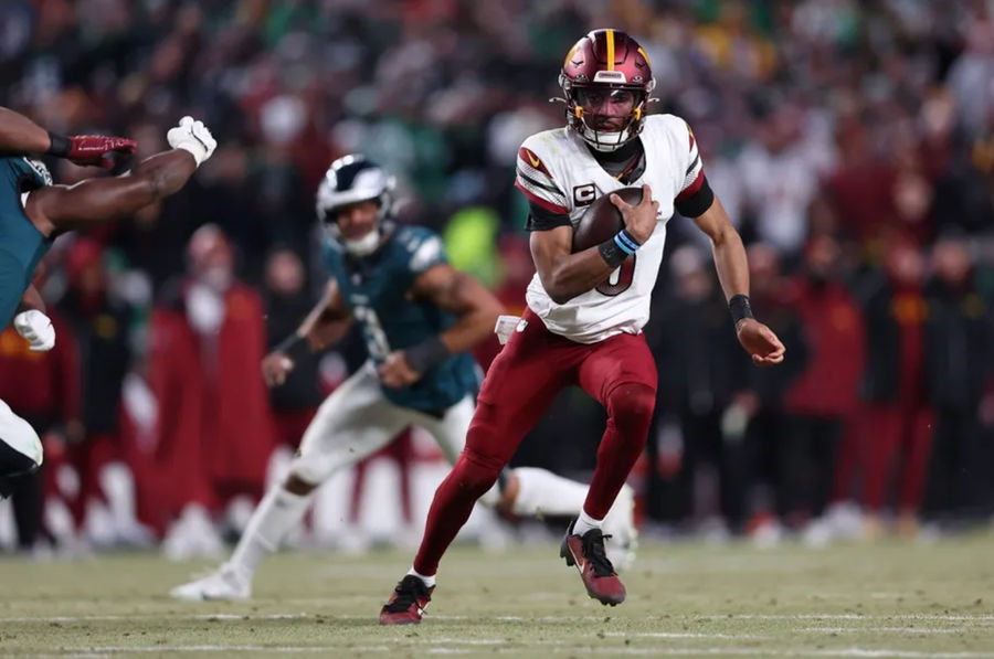 Jan 26, 2025; Philadelphia, PA, USA; Washington Commanders quarterback Jayden Daniels (5) runs with the ball against the Philadelphia Eagles during the second half in the NFC Championship game at Lincoln Financial Field. Mandatory Credit: Bill Streicher-Imagn Images