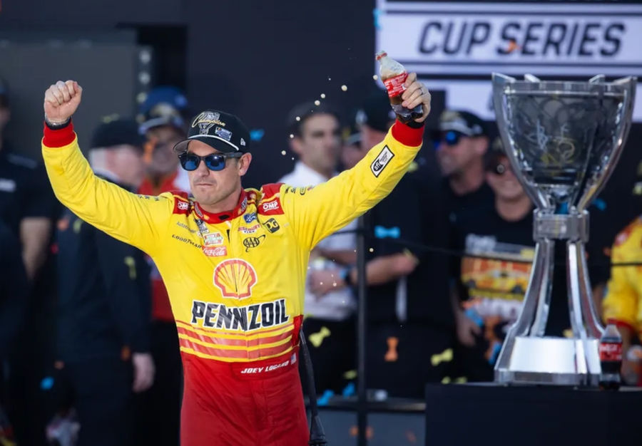 Nov 10, 2024; Avondale, Arizona, USA; NASCAR Cup Series driver Joey Logano (22) celebrates after winning the 2024 NASCAR Cup Series championship and the NASCAR Cup Series Championship race at Phoenix Raceway. Mandatory Credit: Mark J. Rebilas-Imagn Images