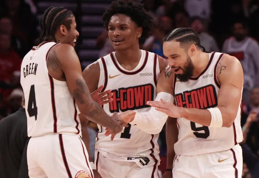 Feb 12, 2025; Houston, Texas, USA; Houston Rockets guard Jalen Green (4) and forward Amen Thompson (1) celebrate with forward Dillon Brooks (9) after a three point basket against the Phoenix Suns in the second half at Toyota Center. Mandatory Credit: Thomas Shea-Imagn Images