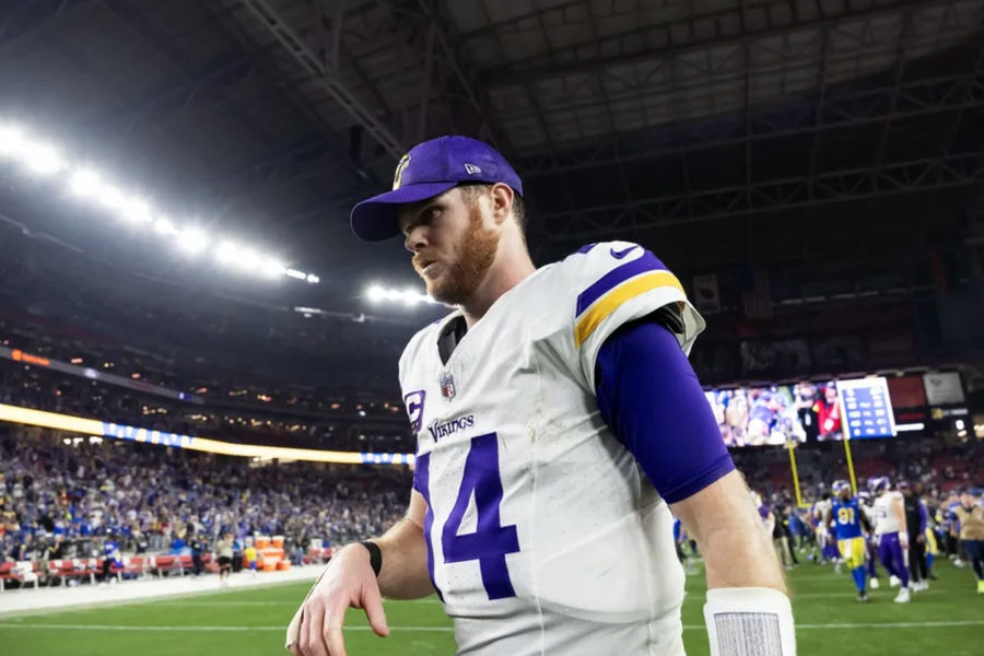 Jan 13, 2025; Glendale, AZ, USA; Minnesota Vikings quarterback Sam Darnold (14) reacts as he walks off the field after losing to the Los Angeles Rams during an NFC wild card game at State Farm Stadium. Mandatory Credit: Mark J. Rebilas-Imagn Images