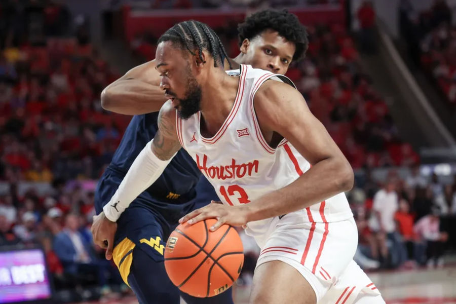 Jan 15, 2025; Houston, Texas, USA; Houston Cougars forward J'Wan Roberts (13) dribbles against West Virginia Mountaineers forward Amani Hansberry (13) in the first half at Fertitta Center. Mandatory Credit: Thomas Shea-Imagn Images