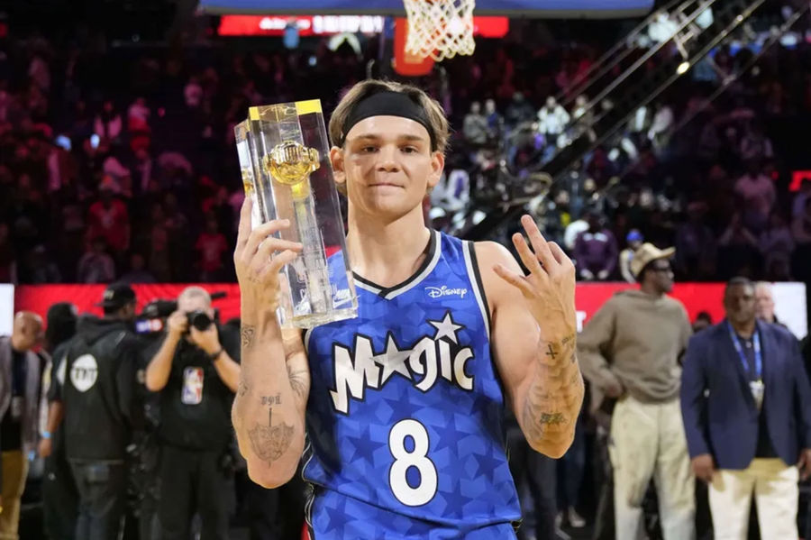 Feb 15, 2025; San Francisco, CA, USA; Osceola Magic guard Mac McClung celebrates with the trophy after winning the slam dunk competition during All Star Saturday Night ahead of the 2025 NBA All Star Game at Chase Center. Mandatory Credit: Kyle Terada-Imagn Images