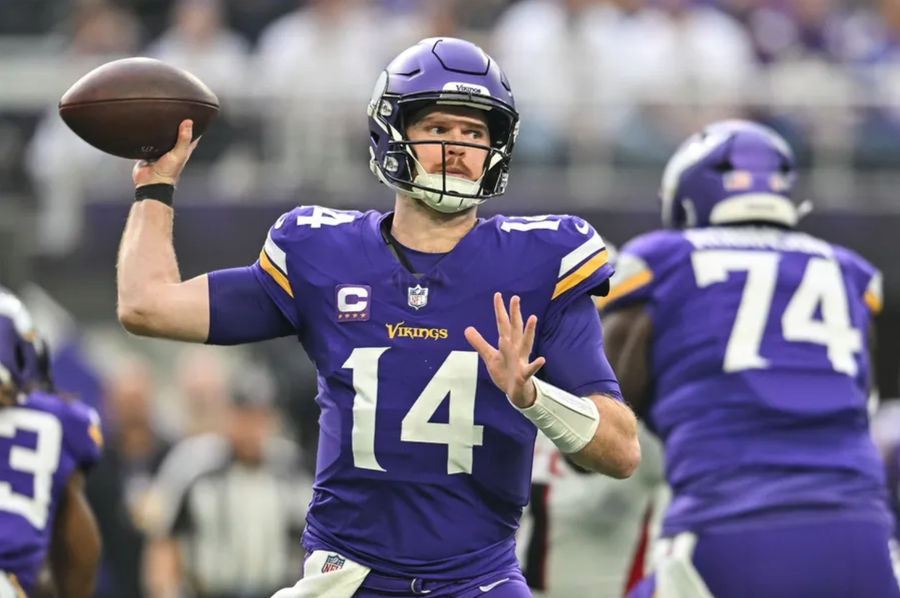 Dec 8, 2024; Minneapolis, Minnesota, USA; Minnesota Vikings quarterback Sam Darnold (14) throws a pass against the Atlanta Falcons during the first quarter at U.S. Bank Stadium. Mandatory Credit: Jeffrey Becker-Imagn Images