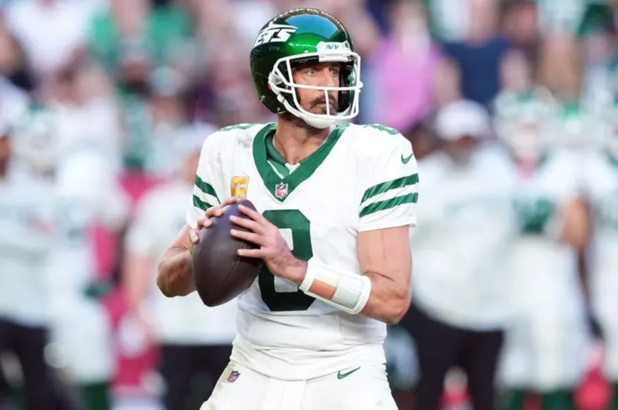 Nov 10, 2024; Glendale, Arizona, USA; New York Jets quarterback Aaron Rodgers (8) passes against the Arizona Cardinals during the second half at State Farm Stadium. Mandatory Credit: Joe Camporeale-Imagn Images