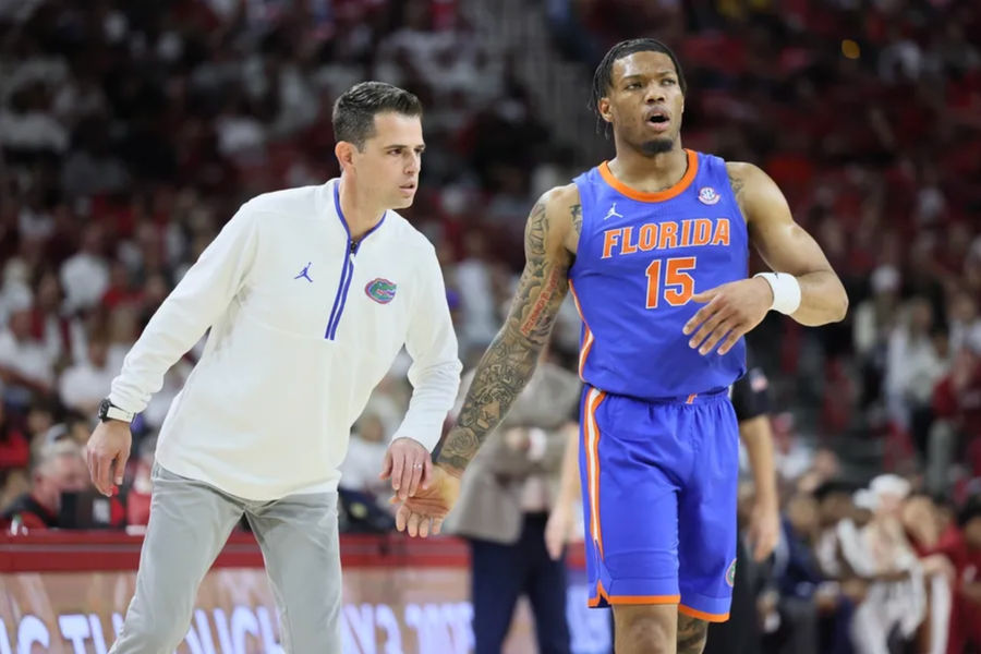 Jan 11, 2025; Fayetteville, Arkansas, USA; Florida Gators head coach Todd Golden talks to guard Alijah Martin (15) during the second half against the Arkansas Razorbacks at Bud Walton Arena. Mandatory Credit: Nelson Chenault-Imagn Images