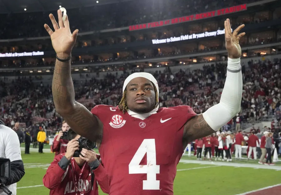 Nov 30, 2024; Tuscaloosa, Alabama, USA; Alabama Crimson Tide quarterback Jalen Milroe (4) celebrates after defeating the Auburn Tigers at Bryant-Denny Stadium. Alabama won 28-14. Mandatory Credit: Gary Cosby Jr.-Imagn Images