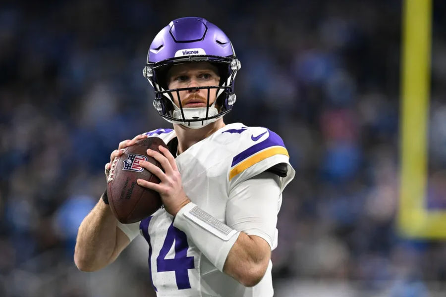 Jan 5, 2025; Detroit, Michigan, USA; Minnesota Vikings quarterback Sam Darnold (14) throws passes during pregame warmups before their game against the Detroit Lions at Ford Field. Mandatory Credit: Lon Horwedel-Imagn Images