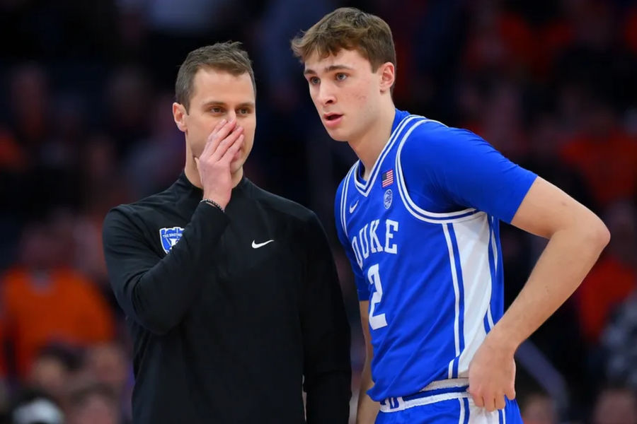 Feb 5, 2025; Syracuse, New York, USA; Duke Blue Devils head coach Jon Scheyer talks with guard Cooper Flagg (2) against the Syracuse Orange during the first half at the JMA Wireless Dome. Mandatory Credit: Rich Barnes-Imagn Images