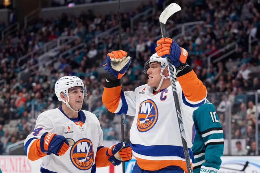 Mar 8, 2025; San Jose, California, USA; New York Islanders left wing Anders Lee (27) celebrates with center Jean-Gabriel Pageau (44) after scoring a goal against the San Jose Sharks during the third period at SAP Center at San Jose. Mandatory Credit: Robert Edwards-Imagn Images