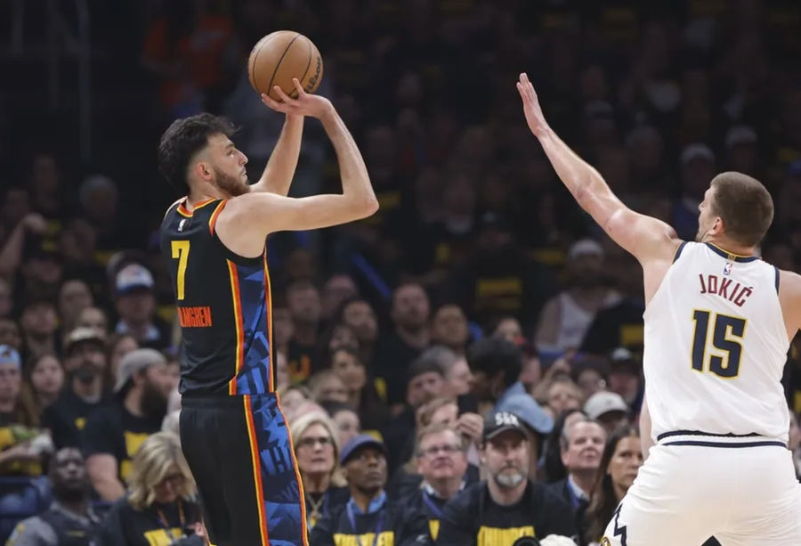 May 7, 2025; Oklahoma City, Oklahoma, USA; Oklahoma City Thunder Advanced Chet Holmgren (7), Denver Nuggets Center Nikola Jokic (15) is defending a three -point basket in the first quarter for the 2025 NBA playoffs in Paycom Center. Compulsory Credit: Alonzo Adams-Imagn Images