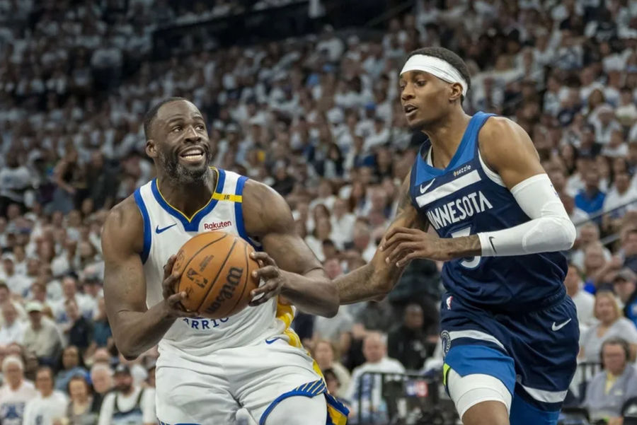 May 8, 2025; Minneapolis, Minnesota, USA; Golden State Warriors argues Draymond Green (23), passing the Minnesota Timberwolves to Jaden McDaniels (3), in the second half of the second round for the 2025 NBA playoffs in the target center. Compulsory Credit: Jesse Johnson-Imagn Images