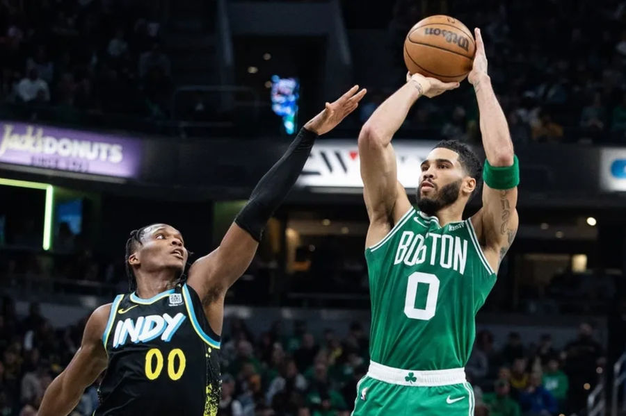 Jan 6, 2024; Indianapolis, Indiana, USA; Boston Celtics forward Jayson Tatum (0) shoots the ball against Indiana Pacers guard Bennedict Mathurin (00) in the first half at Gainbridge Fieldhouse. credits: Trevor Ruszkowski-USA TODAY Sports