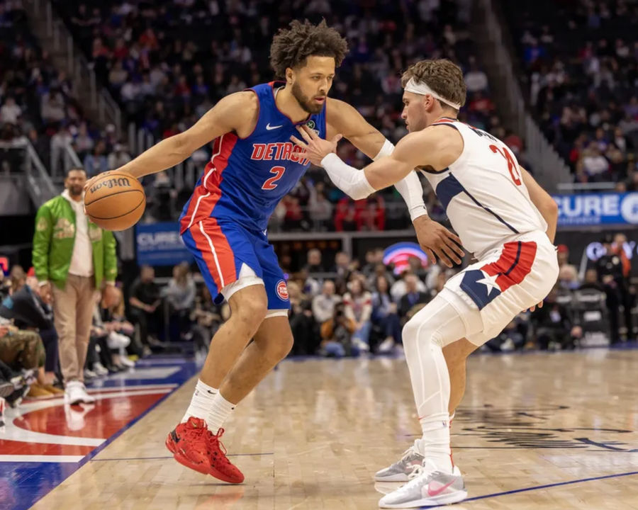 March 11, 2025; Detroit, Michigan, USA; Washington Vizards Corey Kispert (24) defended the Detroit Piston Guard Cad Cunningham (2) in the second half in Little Caesar Arena. Compulsory Credit: David Regennek-Imgon Picture