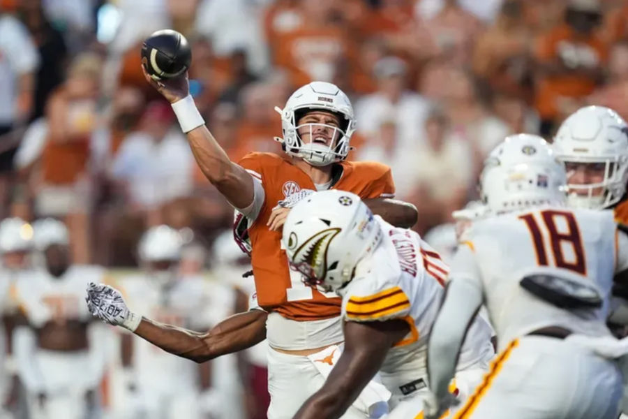 Sep 21, 2024; Austin, Texas, USA; Texas Longhorns quarterback Arch Manning (16) hit as he throws a pass against the Louisiana Monroe Warhawks in the first half at Darrell K Royal-Texas Memorial Stadium. Mandatory Credit: Daniel Dunn-Imagn Images