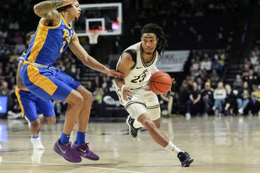 1 February, 2025; Winston-Salem, Northern Carolina, USA; Wake Forest Danav Decons Guard Hunter Solis (23) Handle against Cameron Koren (2) against Pittsburgh Panthers during the first half in Lawrence Joel Veterans Memorial Collizium. Compulsory Credit: Jim Deadmon-Imgon Picture