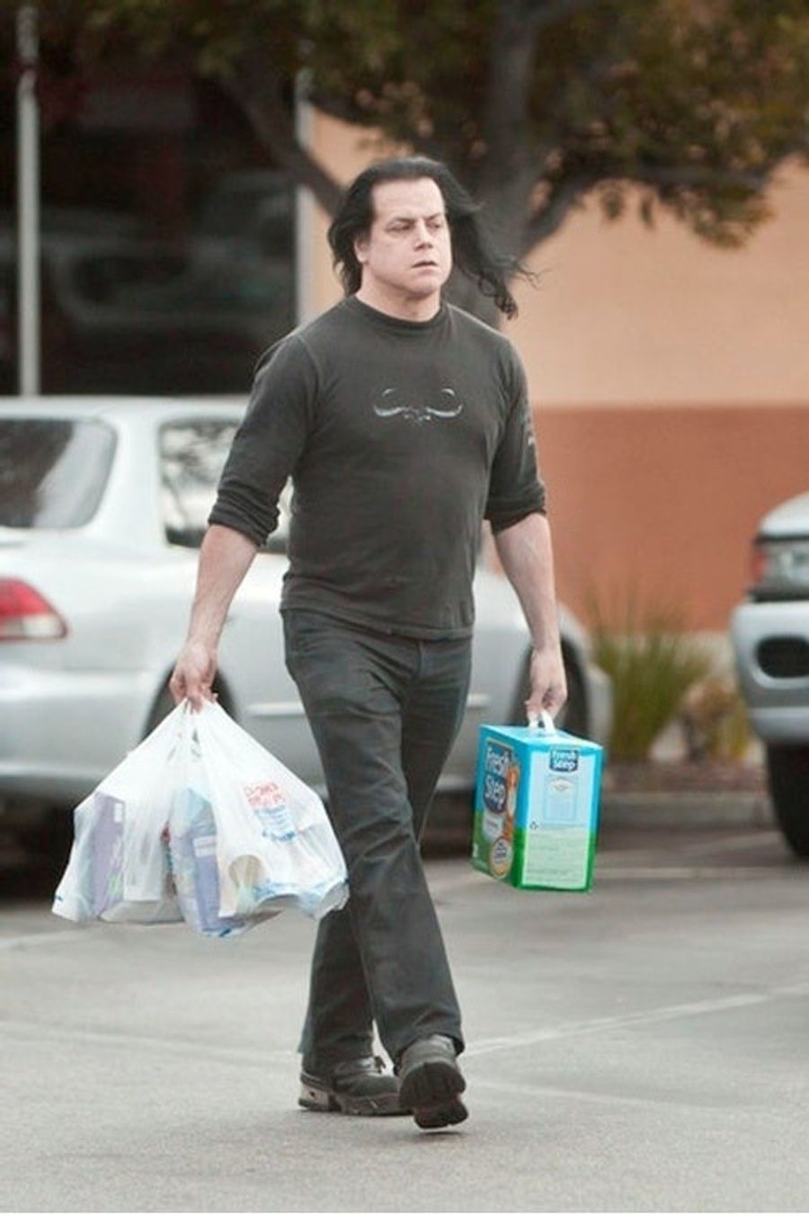 This Is A Photo Of Danzig Wearing A Danzig Shirt After Buying Cat Supplies