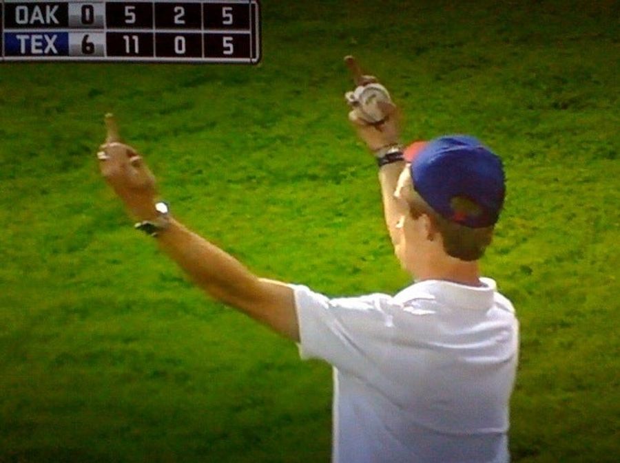 Texas Fan Celebrates His New Souvenir With A Double-Barreled Salute