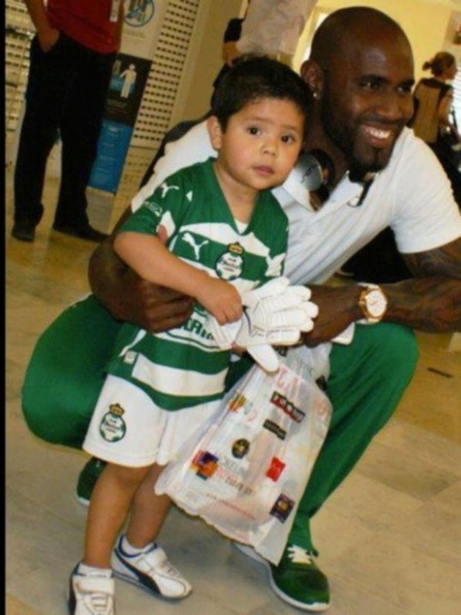 Soccer Player Takes Photo With Adorable Child—And <i>Playboy</i> Magazine He Just Bought