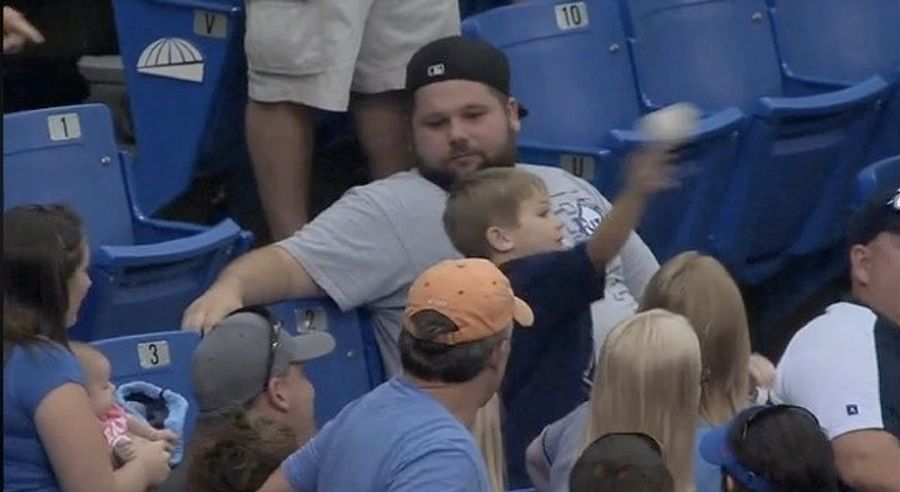 Man Gives Child Baseball, Child Tries To Throw Baseball Back