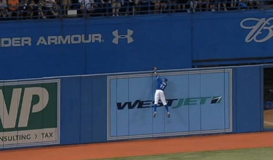 Rajai Davis Goes Above The Rogers Centre Outfield Wall For A Home Run-Robbing Catch