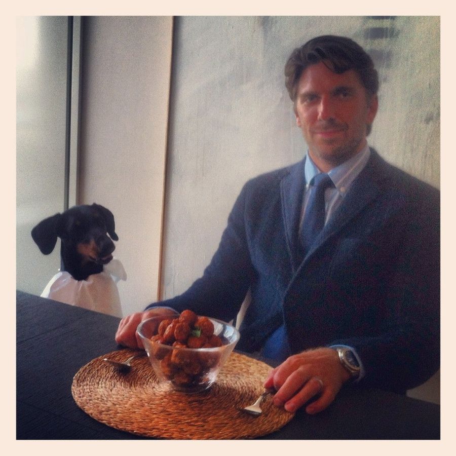Here's Henrik Lundqvist And His Doberman Sitting Down To A Meal