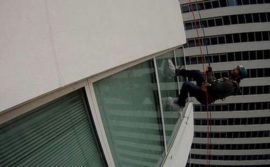 Locked-Out Hockey Player Scales Tall Building