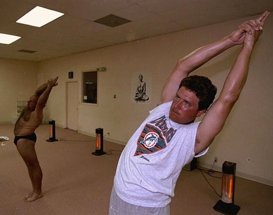 Here's An Old Photo Of Dan Marino Doing Yoga With Some Really Hairy Guy Who's Only Wearing A Speedo