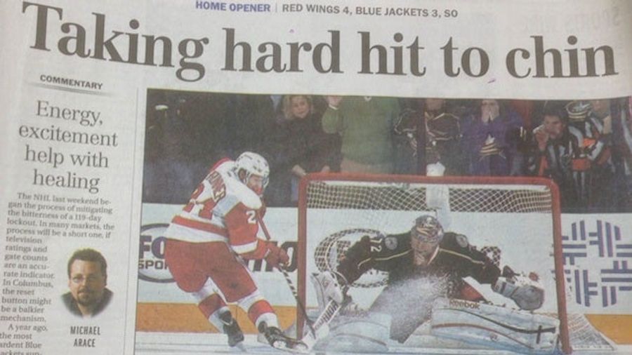Headline Above Newspaper's Blowjob Pantomime Photo: "Taking Hard Hit To Chin"
