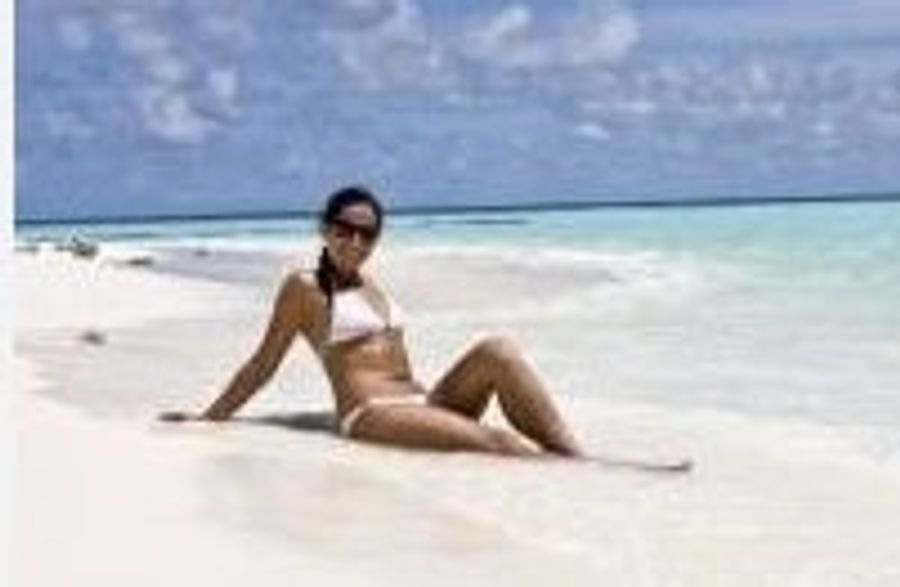 How Would You Like This Oily, Tan Woman In A Bikini To Flirt With You On Facebook?