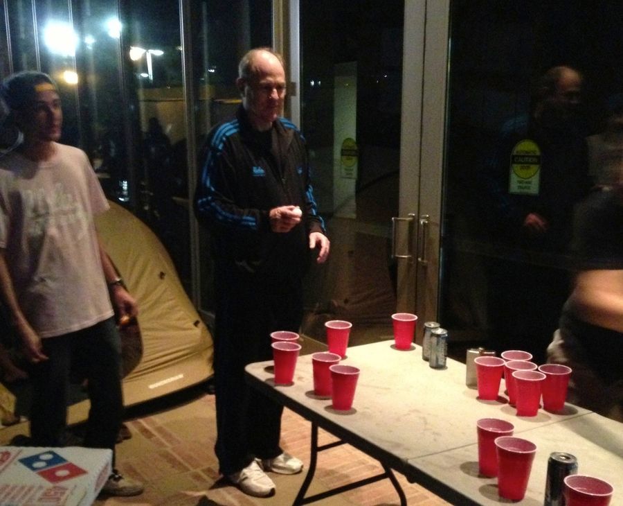Here's A Photo Of UCLA Head Coach Ben Howland, In A Tracksuit, Playing Beer Pong With Students Last Night
