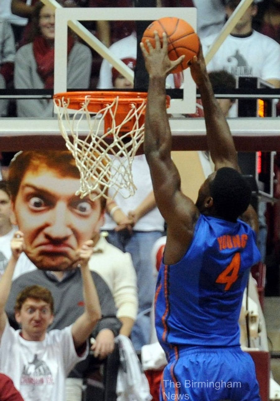 This Alabama Fan Holds A Giant, Bug-Eyed Cutout Of His Face At Games, And We&#39;re Scared