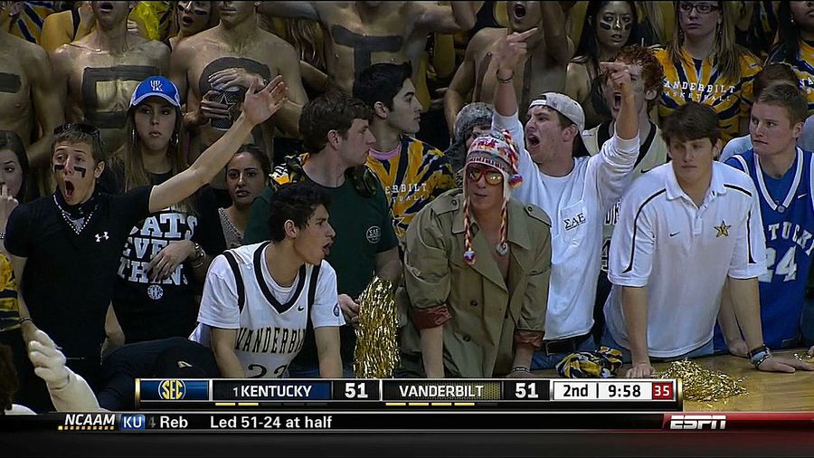 Kentucky-Vanderbilt Featured Your Standard Kid Flipping The Bird Next To A Guy In A Fuzzy Winter Hat With A Trench Coat Shirt And Mirrored Glasses