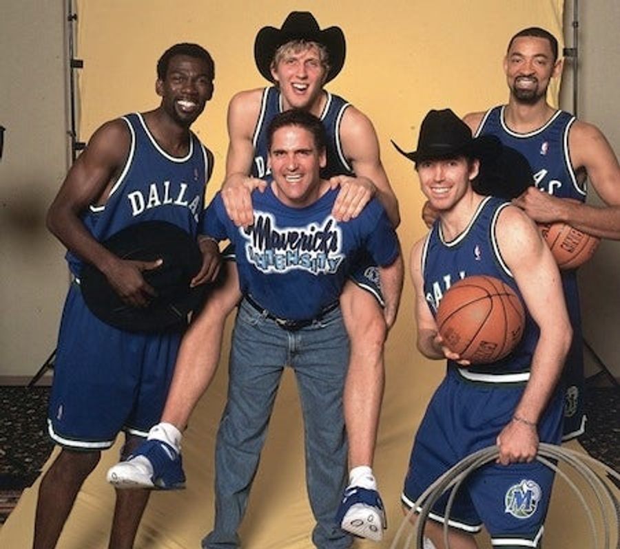 A Photo Of Dirk Nowitzki Astride Mark Cuban, Both Men Enjoying Themselves Immensely