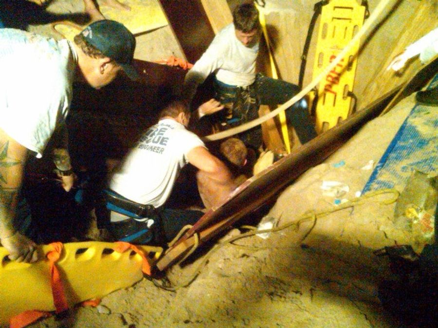 It Took Rescuers Two Hours To Dig An Olympic Swimmer Out Of This Sand Hole