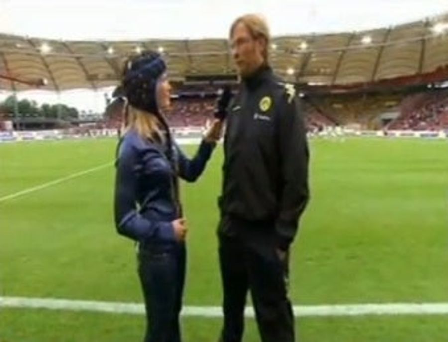 Battered Sideline Reporter Soldiers On, Wears Helmet