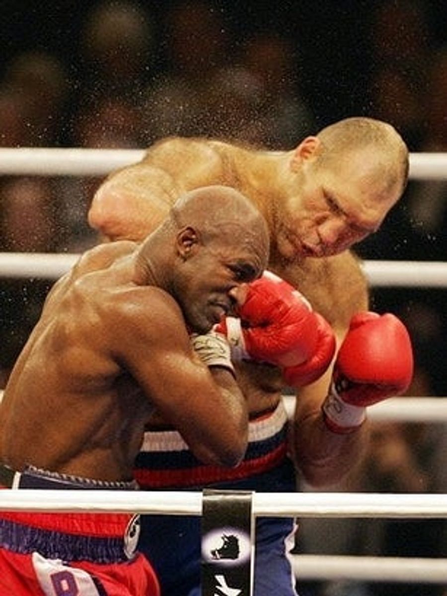 Holyfield Loses Narrow Decision, Survives