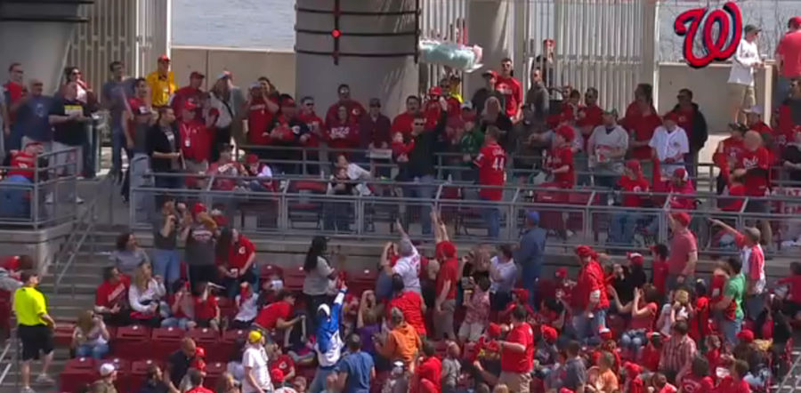 Man Catches Home Run In His Left Hand While Holding Baby With His Right