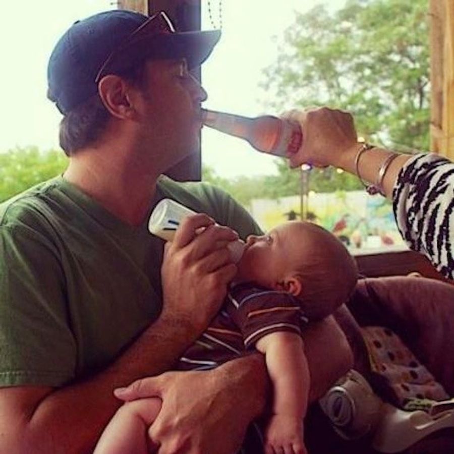 This Sure Looks Like Jay Cutler Drinking A Beer While Feeding His Baby [UPDATE]