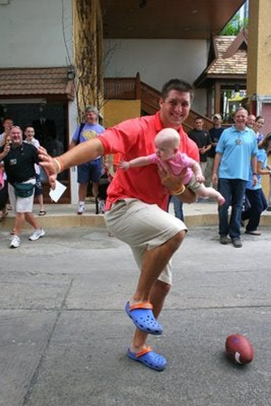 Tim Tebow Is Touching Babies in Asia Again