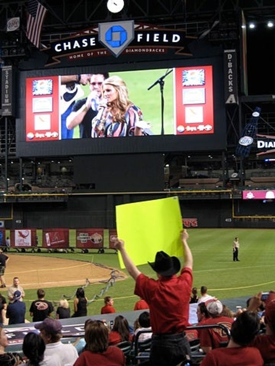 Jessica Simpson Entertains Phoenix Baseball Fans, Car Wreck Aficionados