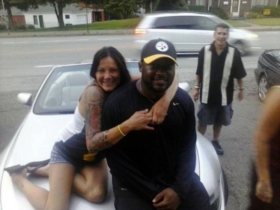 Hey, It's Mike Tomlin And Some Tattooed Woman On The Hood Of A Car