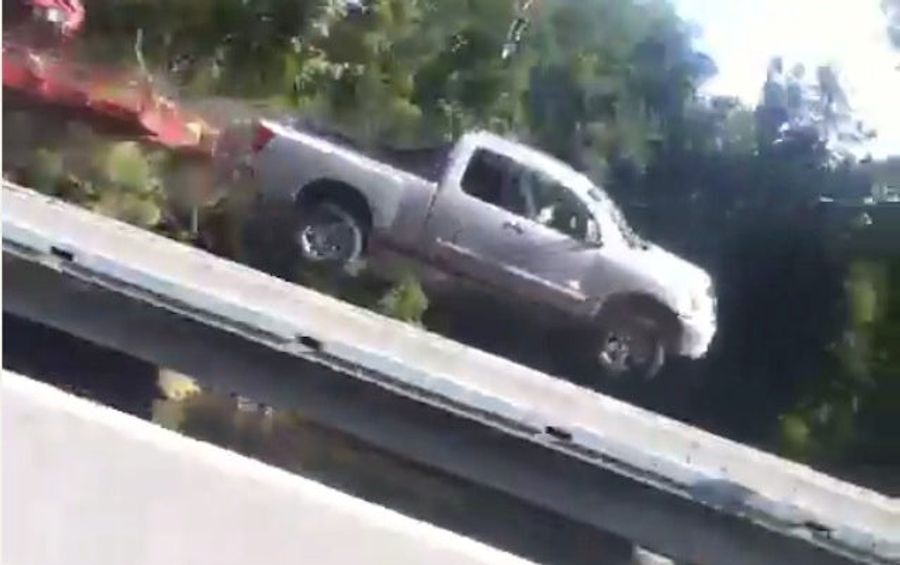 Woman's Vine Captures Exact Moment Truck Flies Over Guardrail