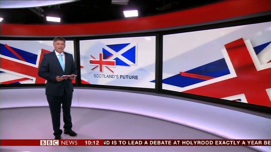 BBC Presenter Introduces News Report Holding A Pack Of Printer Paper